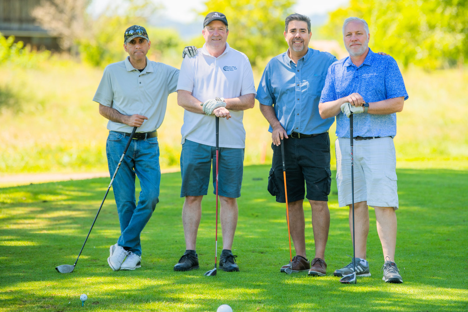 The Century 21 Lund Realtors team poses for a photo Friday in Chehalis during a charity golf tournament raising money for the Hope Alliance.